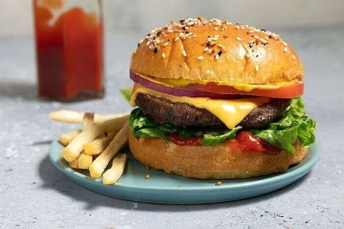 Air-fryer frozen burgers cooked until browned and ready to serve