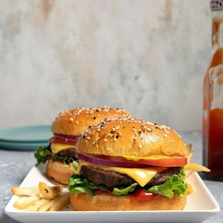 Air-fryer frozen burgers with golden beef patties ready to serve