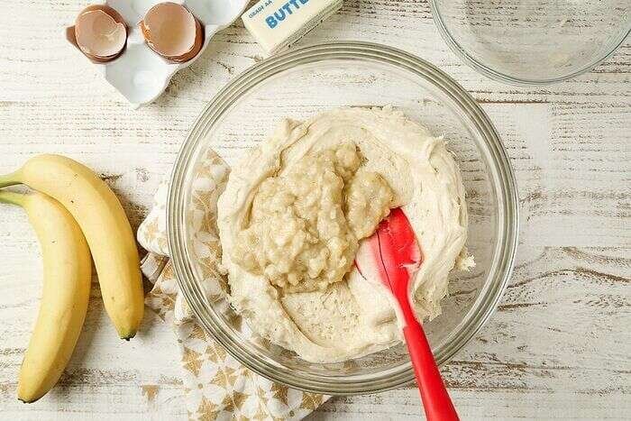 Mashed ripe bananas added to banana bar batter