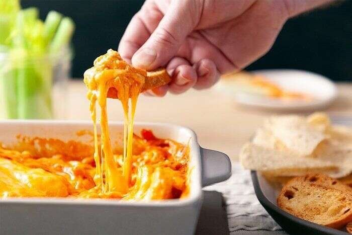 Buffalo chicken dip served with fresh dipping options