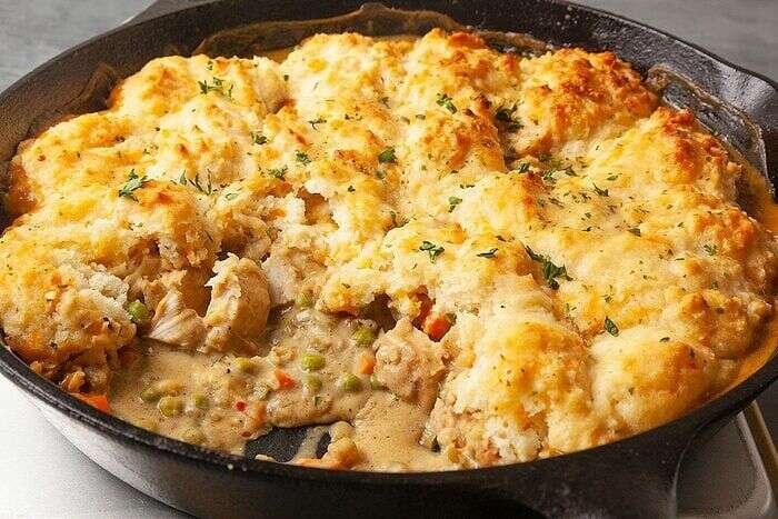 Golden Cheddar Bay Chicken Potpie in a cast iron skillet