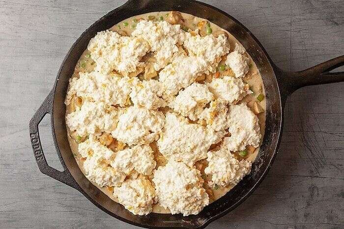 Cheddar Bay biscuit dough spooned over chicken potpie filling before baking