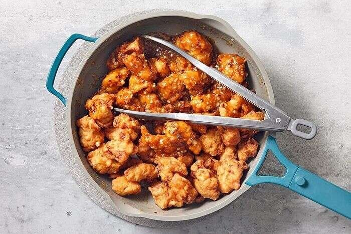 Fried chicken tossed in sweet and spicy orange sauce