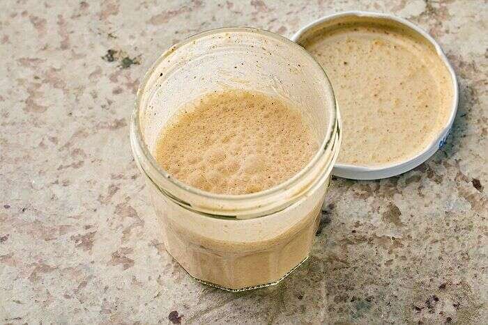 Pumpkin cold foam ingredients shaken in a jar for iced chai latte