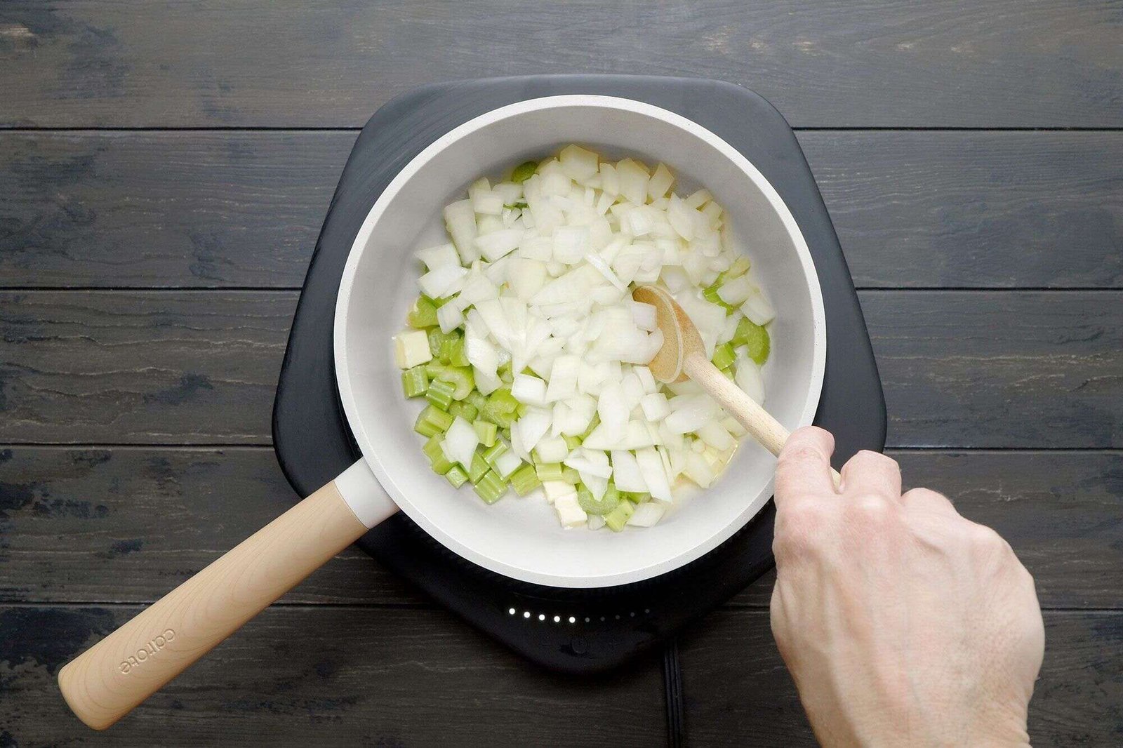 Celery and onion sauteing in butter for cream of broccoli soup