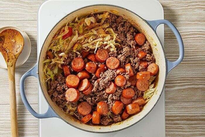 Ground beef and andouille sausage combined with seasoned cabbage