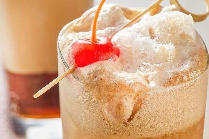 Finished copycat McDonald’s Dirty Dr Pepper with creamy cold foam and cherry