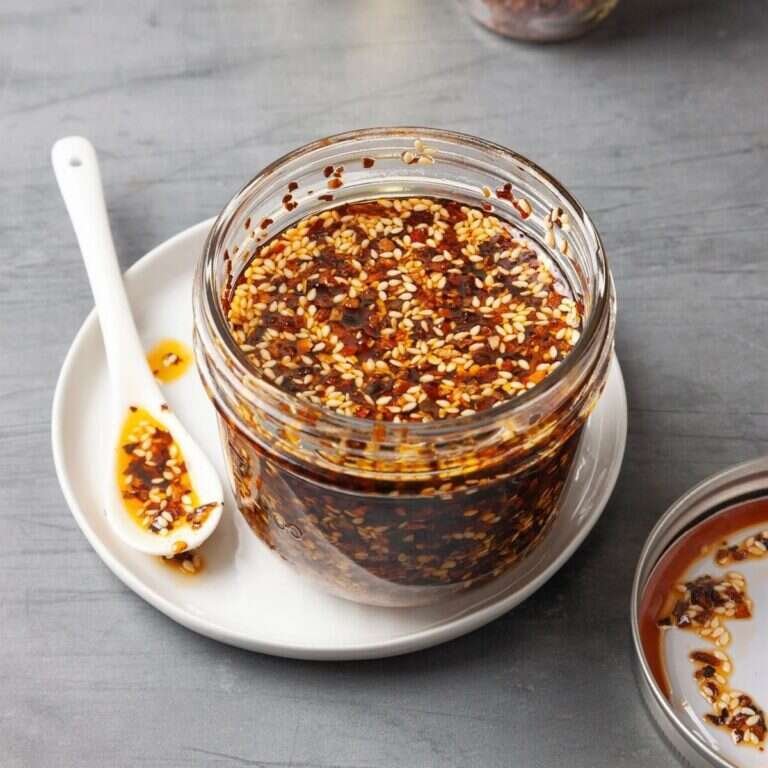 Easy Homemade Chili Crisp Recipe with Crispy Heat Homemade chili crisp in a glass bowl with crispy chili flakes