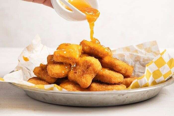 Copycat McDonald’s sweet and sour sauce served with chicken nuggets
