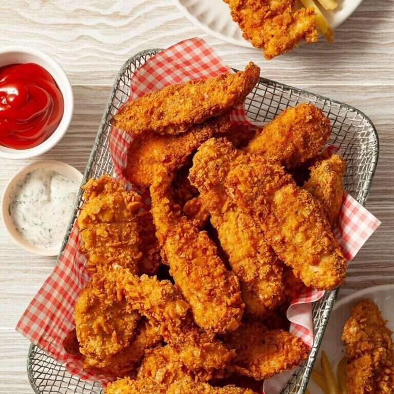 Easy Crispy Chicken Strips Recipe for Family Dinner Crispy chicken strips served with fries and dipping sauce