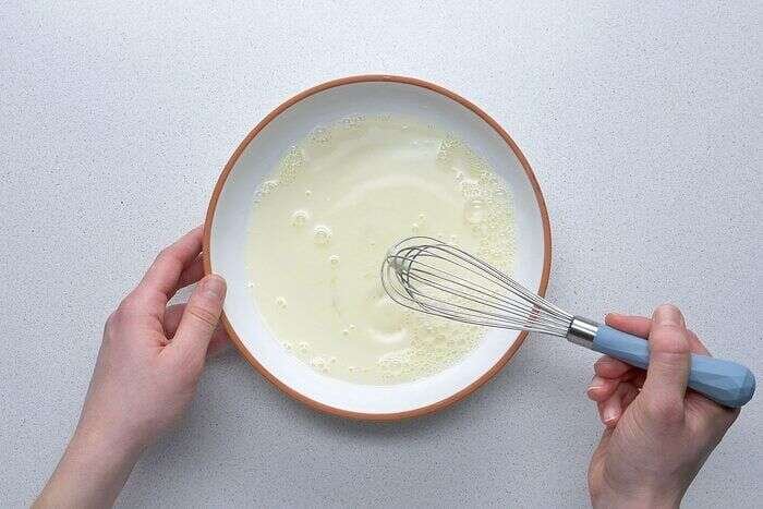 Egg and milk mixture prepared for breaded chicken strips
