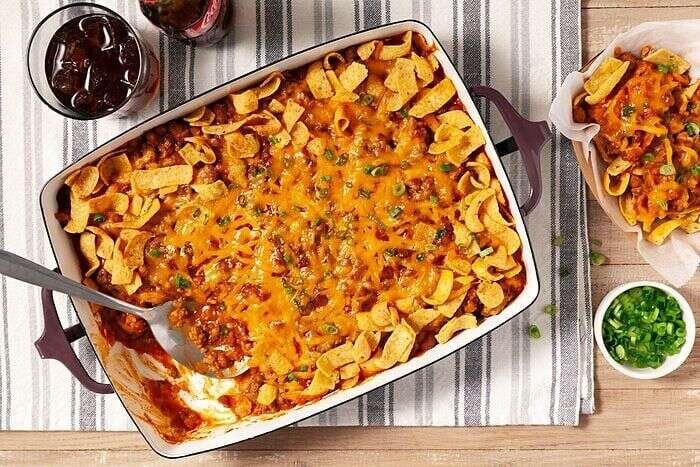Frito pie casserole served with green onions