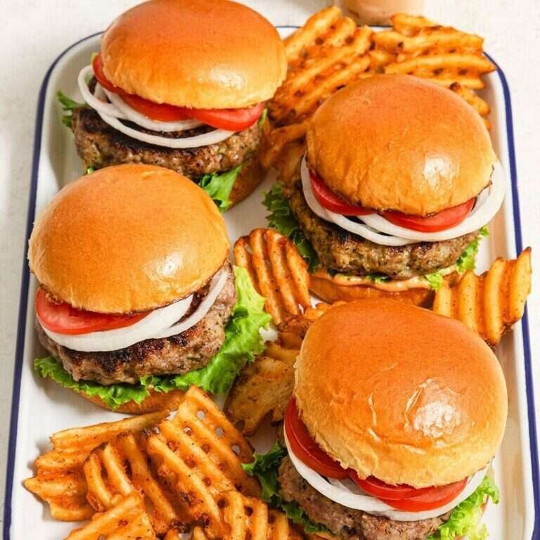 Easy Pork Burgers Recipe for Juicy Grilled Patties Juicy grilled pork burger on a bun with fresh toppings
