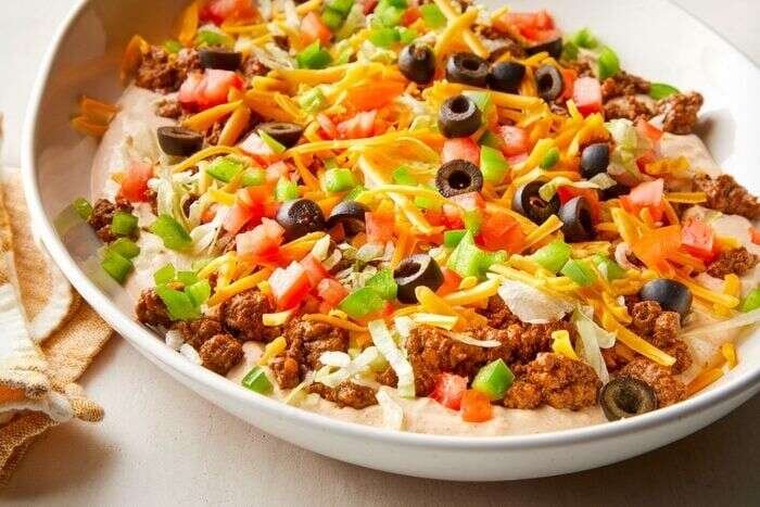 Ground beef taco dip in a large serving dish