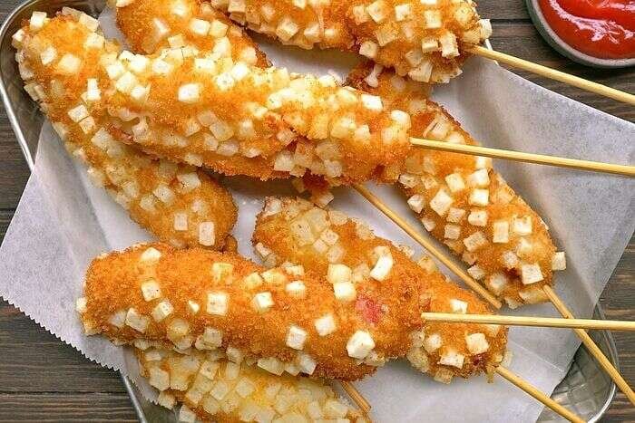 Korean corn dog finished with ketchup