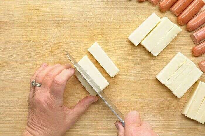 Mozzarella cheese cut into two-inch logs for corn dogs