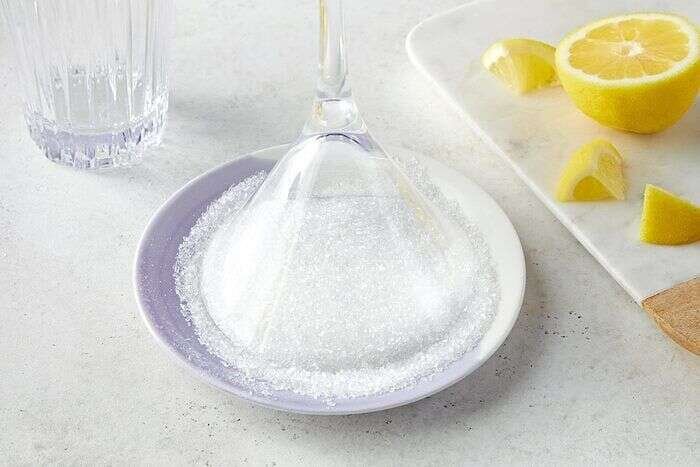 Preparing a sugar rim for a lemon drop martini