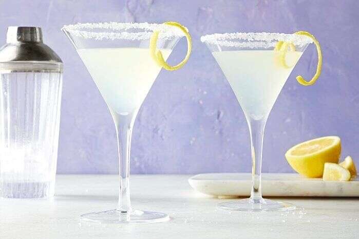 Lemon drop martini ready to serve with a citrus garnish