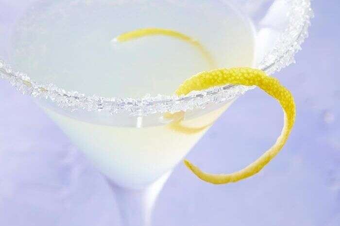 Finished lemon drop martini with lemon garnish