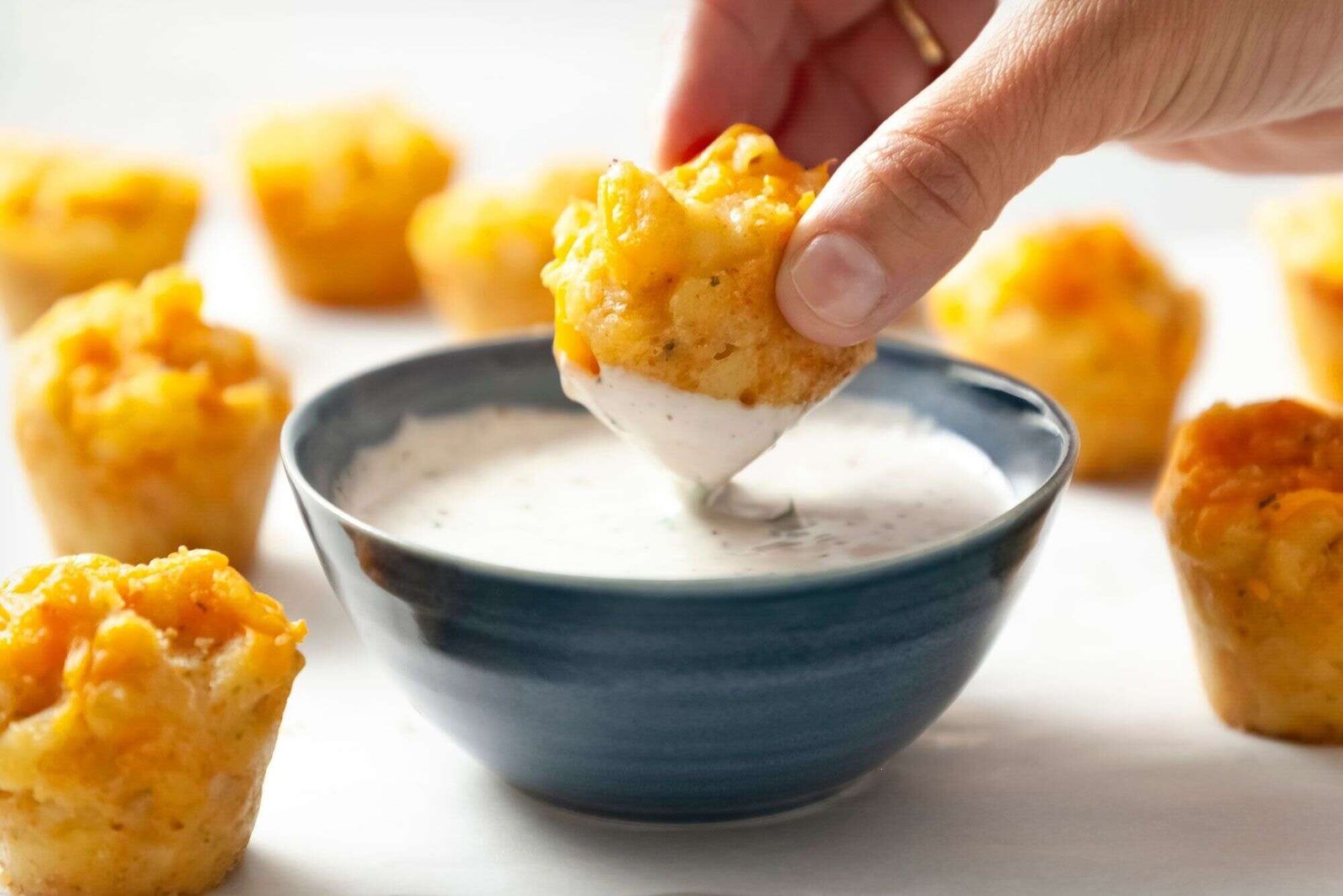 Mini mac and cheese bites served with dipping sauce