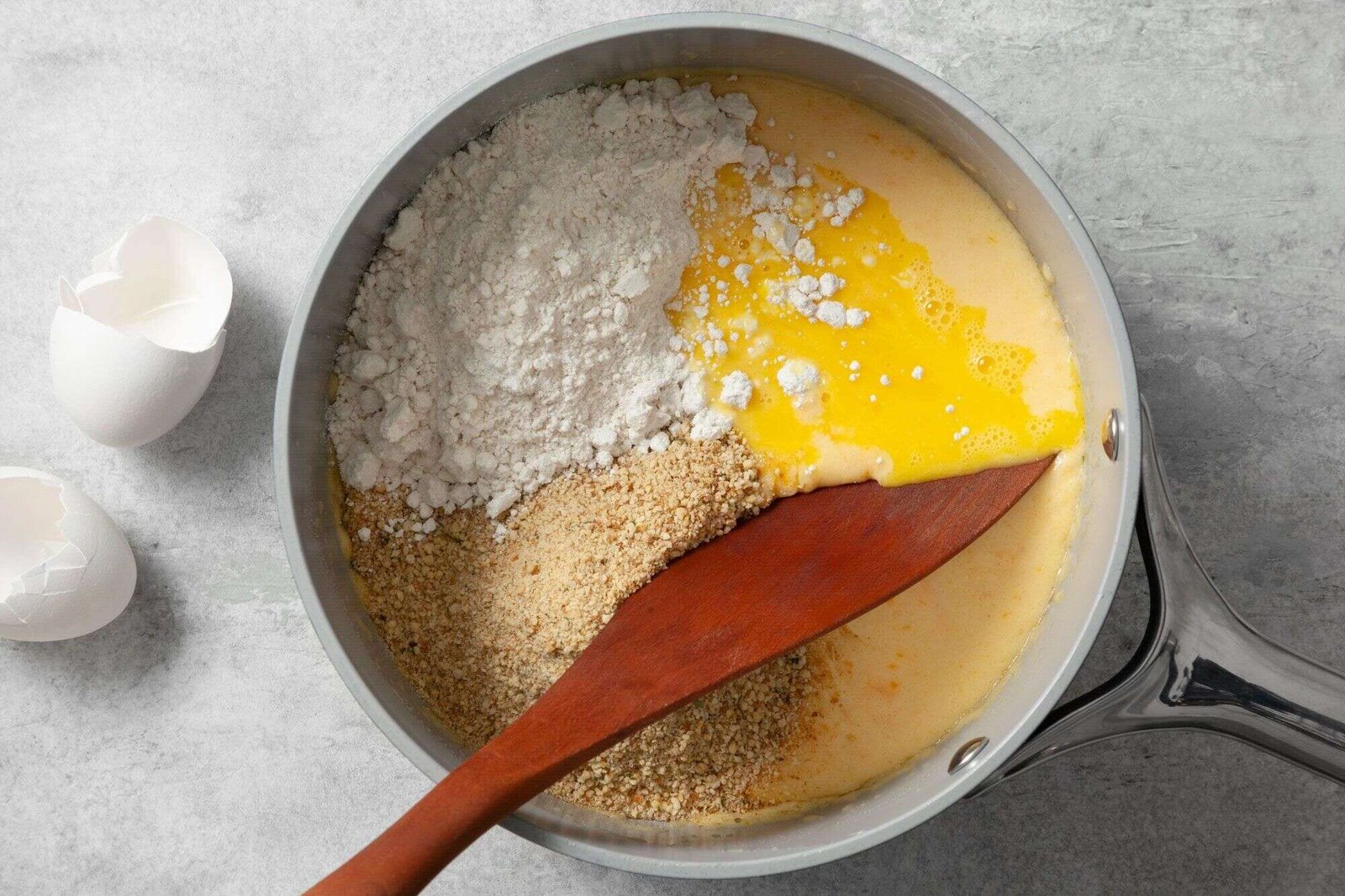 Biscuit mix eggs and breadcrumbs added to mac and cheese mixture
