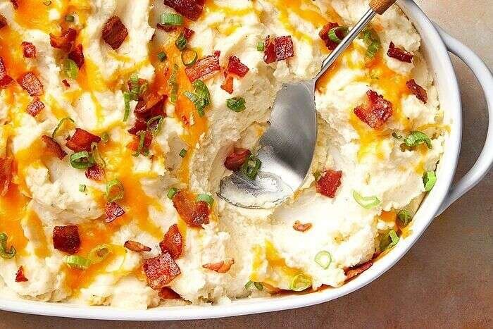 Loaded make-ahead mashed potatoes with cheese bacon and green onions