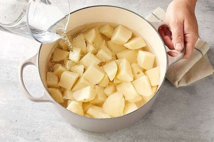 Peeled potatoes covered with water before boiling for mashed potatoes