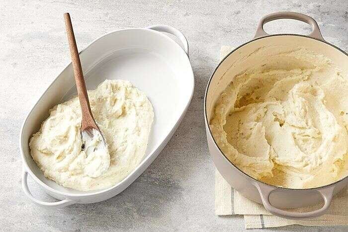 Make-ahead mashed potatoes in a greased baking dish ready to refrigerate