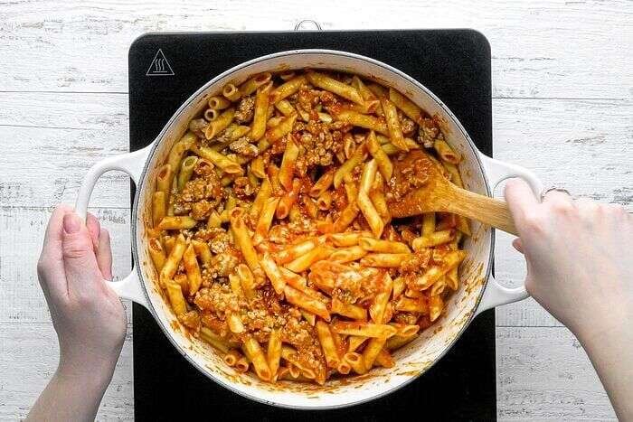 Mostaccioli pasta mixture layered with creamy cheese filling