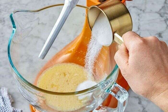 Sugar beaten into eggs for orange olive oil cake
