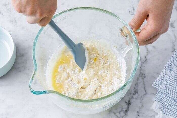 Dry ingredients folded into orange olive oil cake batter