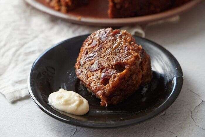 Warm plum pudding with fruit and spices