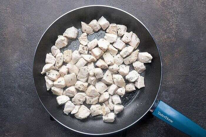 Chicken pieces browning for puff pastry chicken potpie