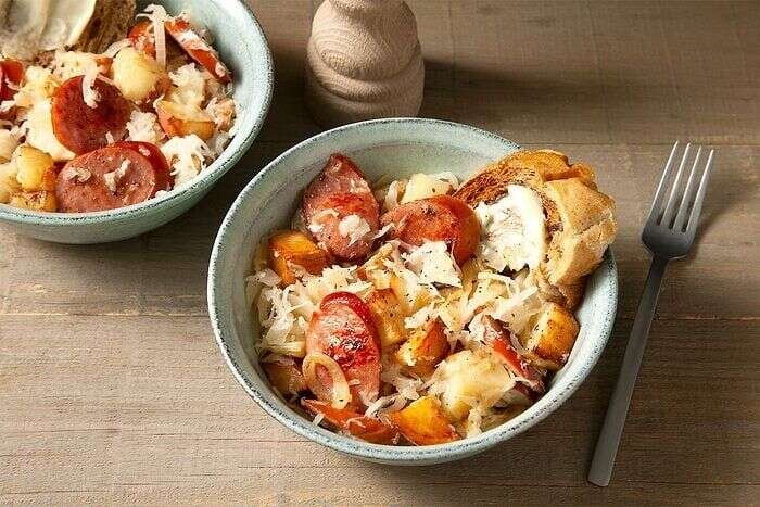 Sausage and sauerkraut skillet served with potatoes and smoked sausage