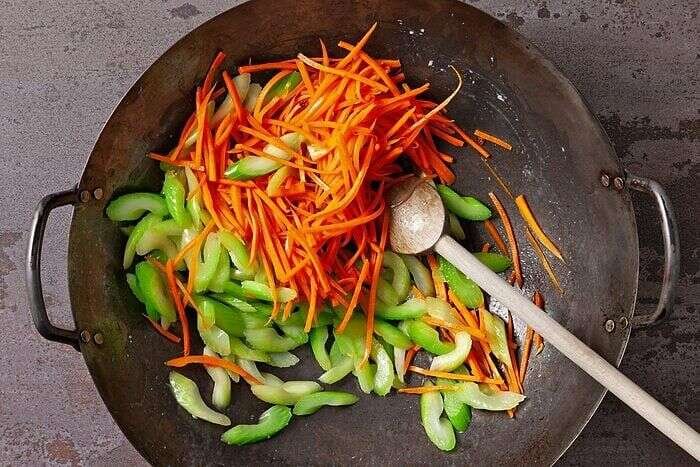 Carrots and celery cooking for shrimp mei fun