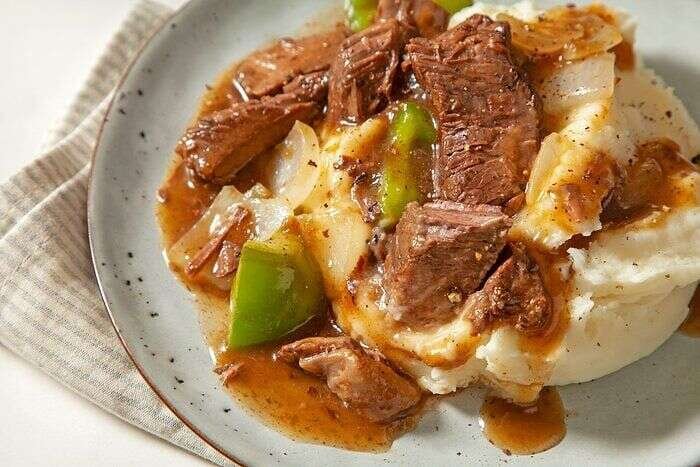 Close-up of slow-cooker sirloin steak served with savory gravy