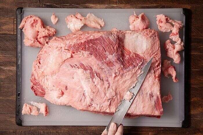 Trimming silverskin and excess fat from a whole beef brisket