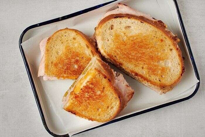 Golden turkey melt with green chiles and melted cheese ready to serve