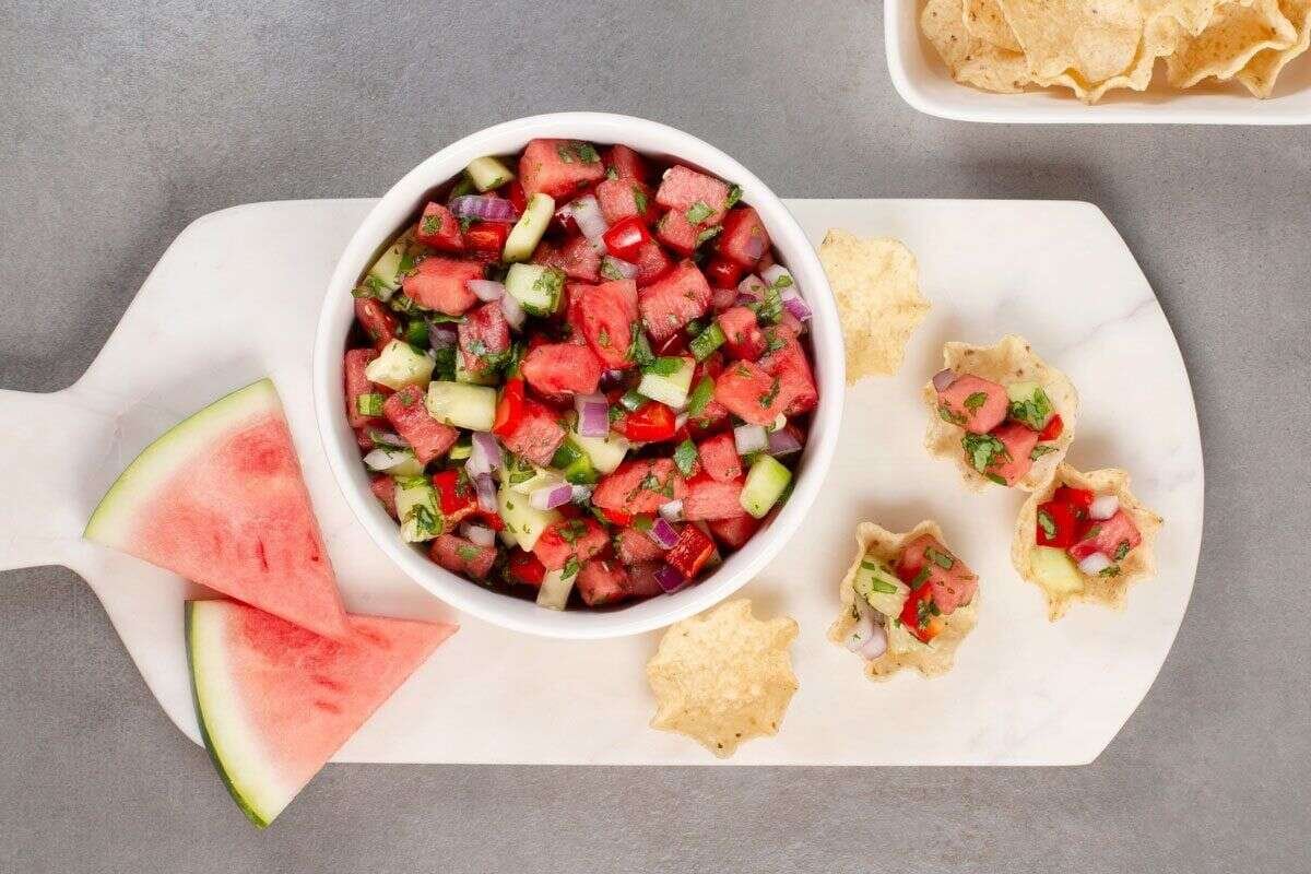 Watermelon salsa and fresh fruit arranged for serving