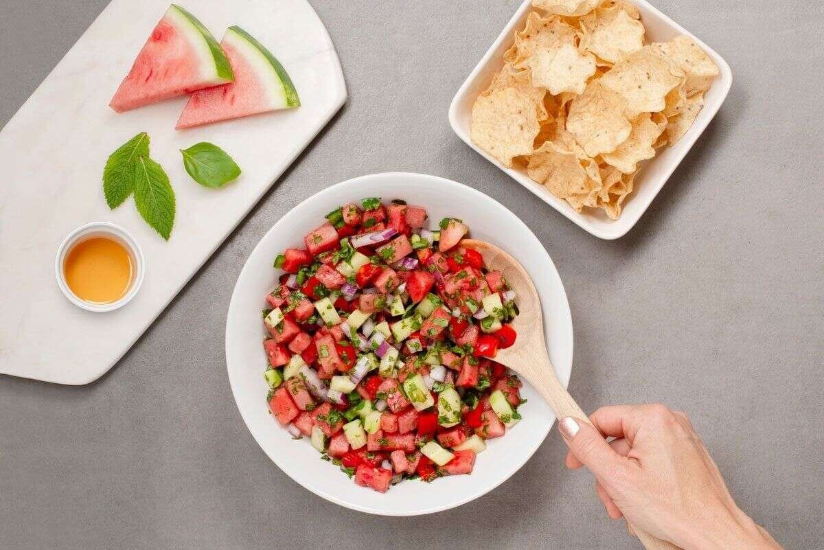 Watermelon salsa ingredients combined in a large bowl