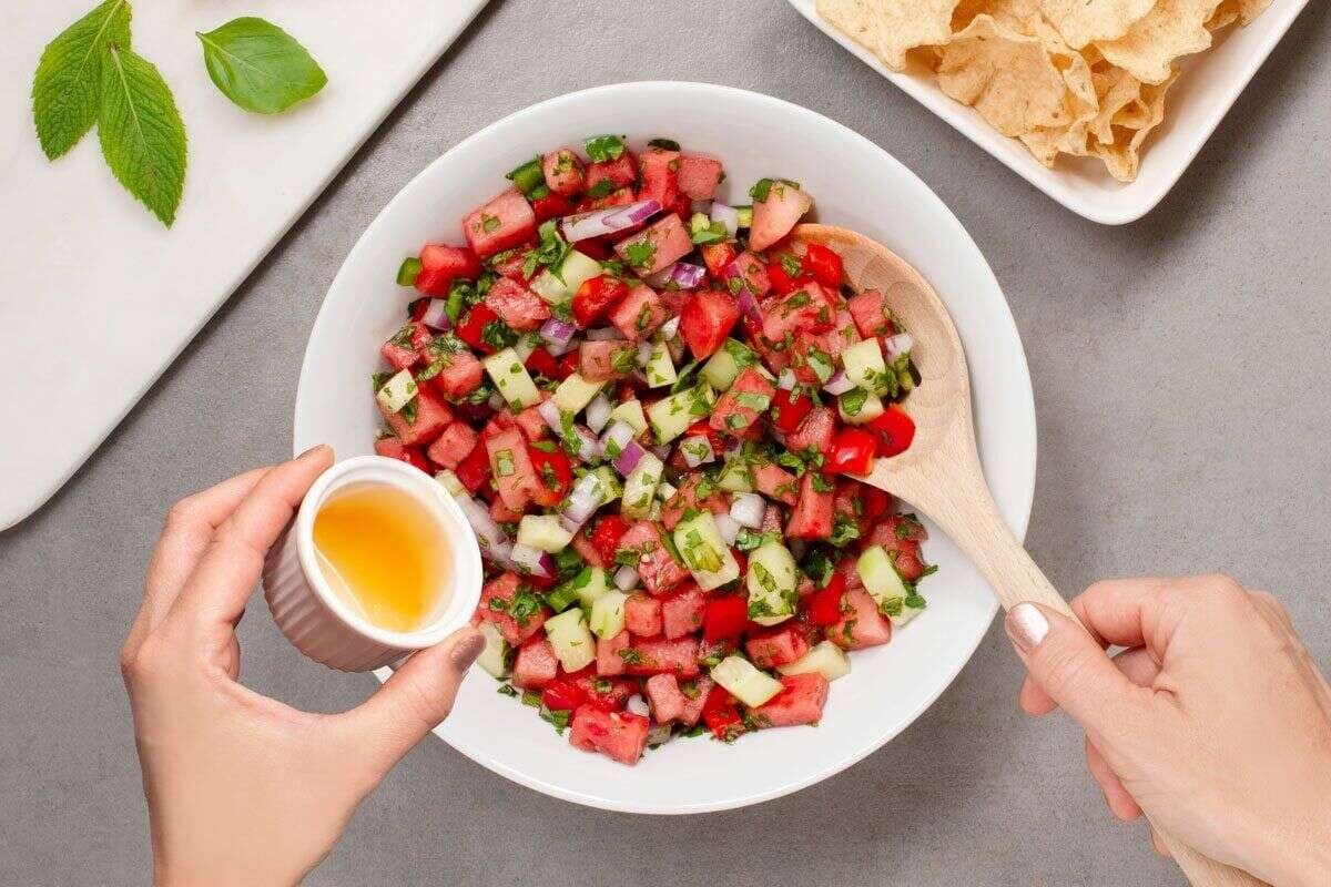 Honey and lime juice drizzled over watermelon salsa ingredients