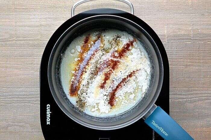 Flour and seasonings whisked into melted butter for white cheddar mac and cheese
