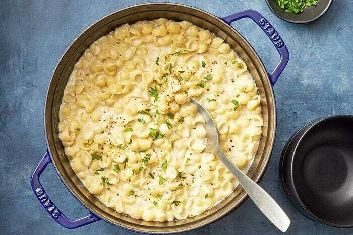 Creamy white cheddar mac and cheese ready to serve