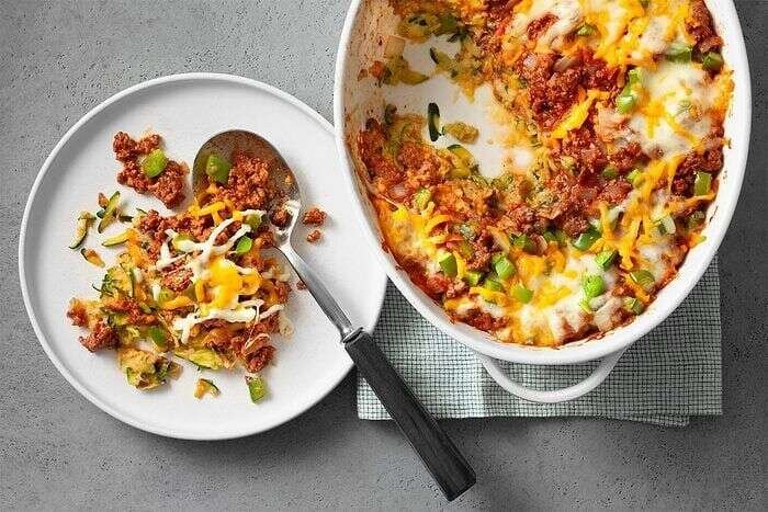 Baked zucchini pizza casserole served with bread
